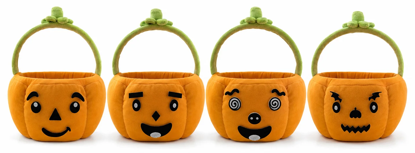 Four different pumpkin faces made with the felt pieces